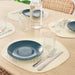 A patterned IKEA place mat in shades of gray and white, ideal for a modern and minimalist table setting. 90531556
