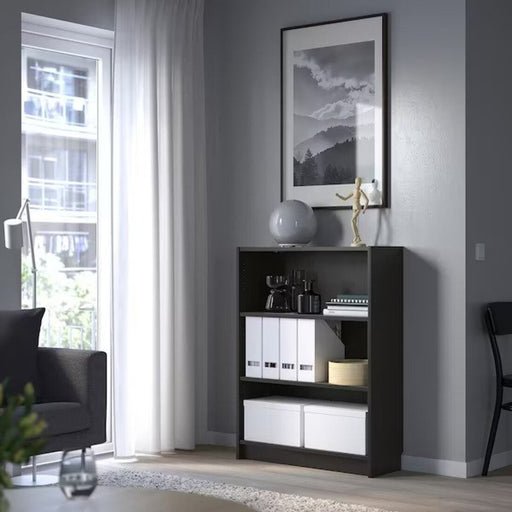 Ikea bookcase with adjustable shelves for versatile storage solutions.40351581