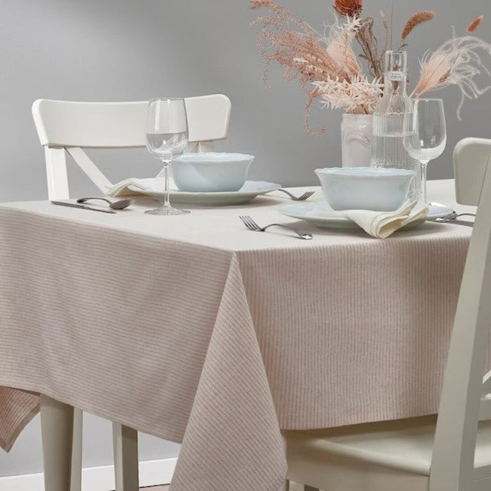 A natural jute table runner with a woven texture and tasseled ends.  60526580