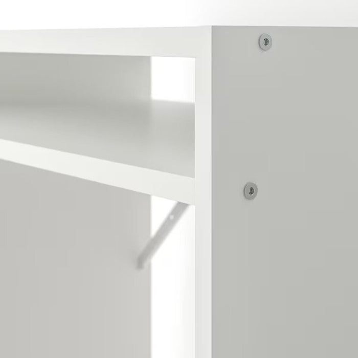 An angled view of a white corner desk with shelves