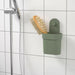 A green container with suction cup for storing sponges or soap bars 40515587
