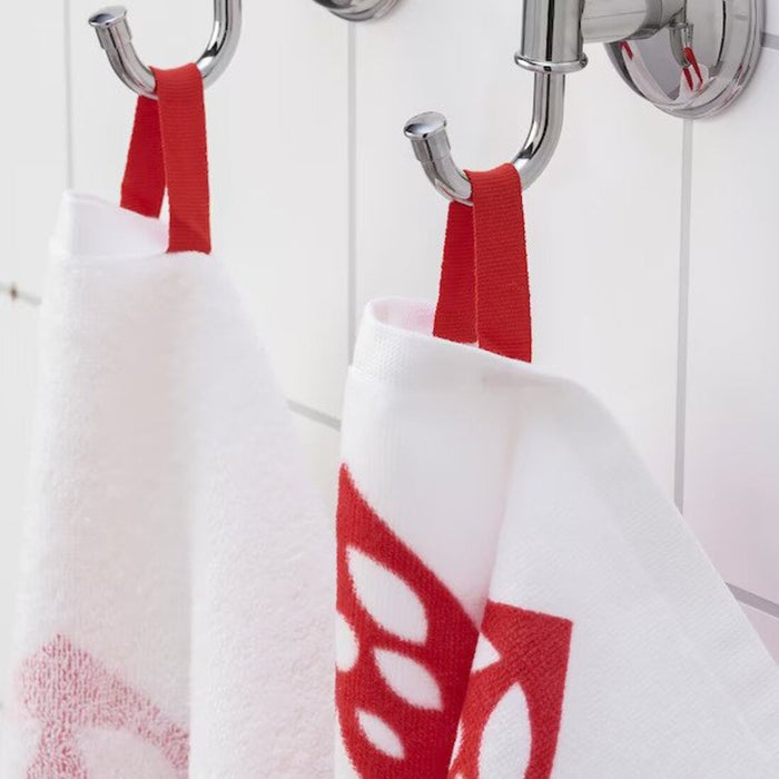 A close-up image of a folded white /red hand towel with a textured pattern and a simple, classic hand towel, perfect for every bathroom 70530548