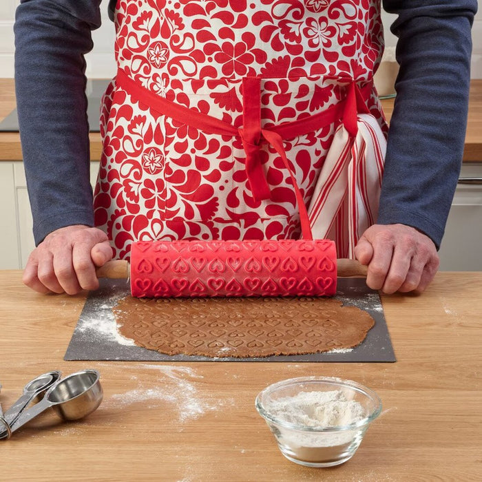 A women is using a rolling pin with rolling cover 80533136