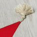 Close-up of an IKEA Santa hat with a fluffy pom-pom on top 10530513