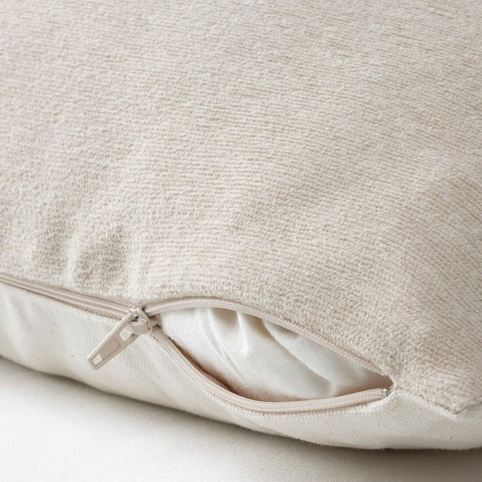 An image of an IKEA cushion cover with a light beige color showcasing its soft texture and hidden zipper- 50492632