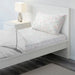 White cotton flat sheet and pillowcase from IKEA on a bed 10512496