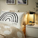 A white cotton pillowcase from IKEA lying on a bed  adding a touch of elegance to the bedding 70526419 