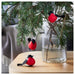 The Hanging Bird Decoration from IKEA, hanging on the pant which is in a vase, creating a statement piece in the space 90524527
