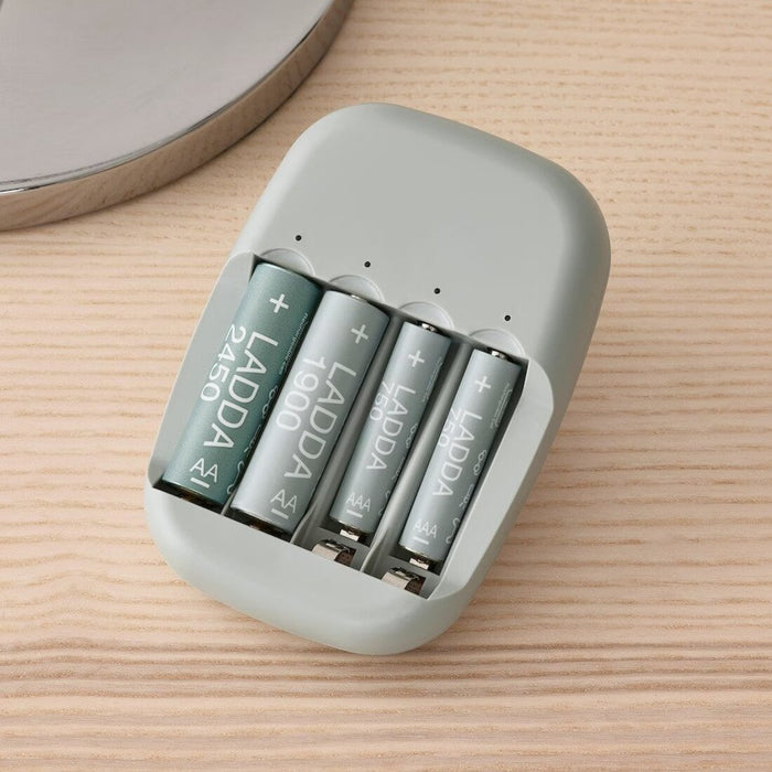 The IKEA Battery Charger in use, with two AA batteries  and two AAA batteries charging  00506448
