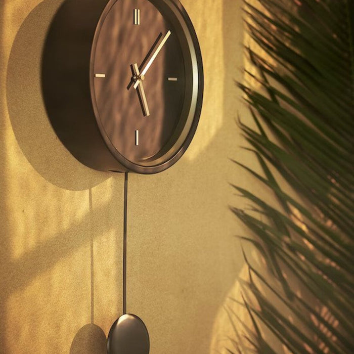 A large wall clock with a visible hour and minute hand 90426744