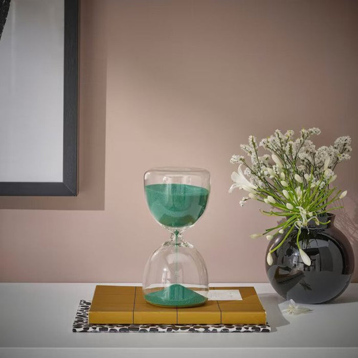 An elegant and versatile clear glass hourglass from IKEA, with a minimalist design that allows it to fit seamlessly into any decor style or room.