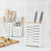 An adjustable Cutlery Stand from IKEA, shown in a kitchen drawer with the compartments expanded and utensils organized.