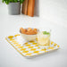 A plastic tray with compartments, containing an assortment of snacks and drinks 40542232
