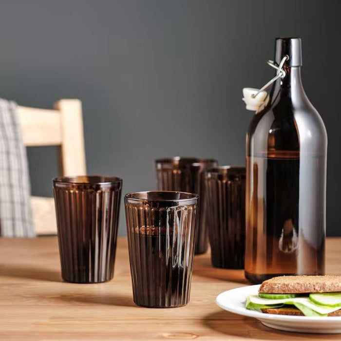 A set of brown drinking glasses from IKEA, perfect for any table setting.