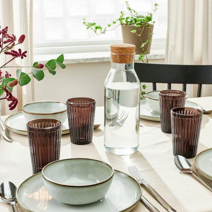 A brown glass pitcher from IKEA, perfect for serving drinks at a dinner party or gathering.