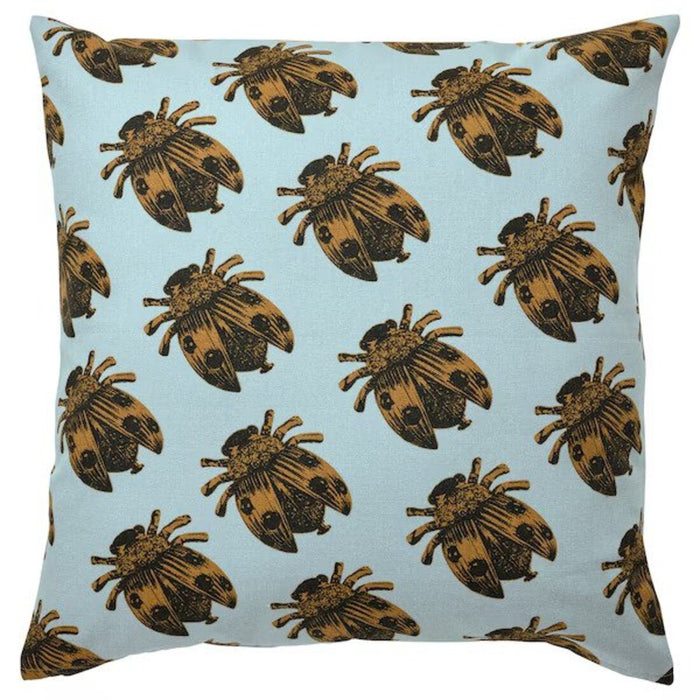 A photo of an Ikea cushion cover in bees on a pale blue on base-10542988