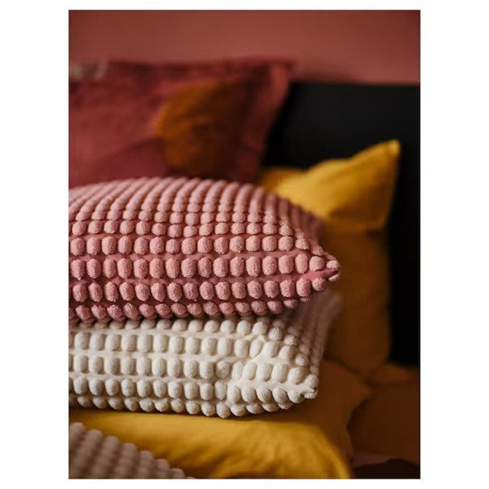 Soft and fluffy cushion cover in light pink, ideal for a comfortable and inviting bedroom setting 60542995