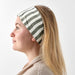 A person with a sensitive scalp wearing an IKEA headband with a soft nylon fastener, looking relaxed and comfortable.