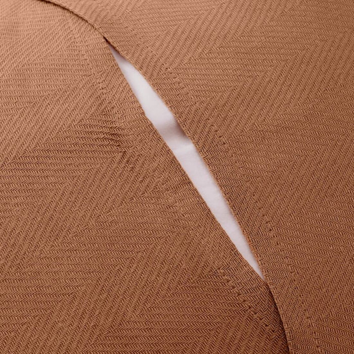 A closeup image of Ikea light grey-green cushion cover envelope closing keeps the cushion in place without the need for zippers or buttons 00511572