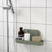 "IKEA suction cup shelf in a modern and clutter-free bathroom