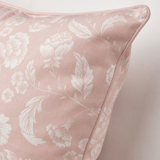 A close-up of an IKEA cushion cover with a light  pink-70526990