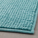 Thick and luxurious turquoise bath mat from IKEA, with a plush texture that provides comfort and warmth to your feet after a shower or bath 80479988