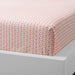 Pink cotton flat sheet and pillowcase from IKEA draped on a bed 30512570