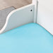 A blue IKEA fitted sheet on a bed with neatly tucked corners and a smooth surface. 50465285 