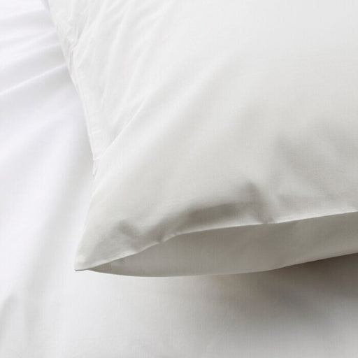 The edge of a white pillowcase from IKEA, highlighting its bright and cheerful color 30347702