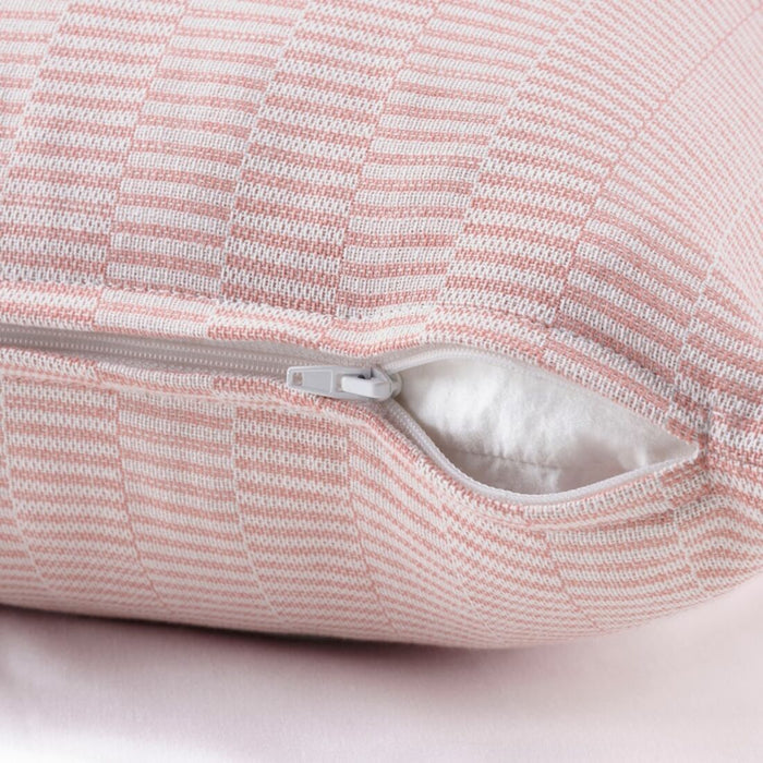 A soft, pink IKEA cushion cover with a red/ whitestriped and hidden zipper closure00506957