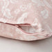 An image of an IKEA cushion cover with a light pink color showcasing its soft texture and hidden zipper-70526990