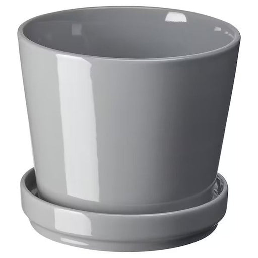 A ceramic plant pot with a smooth surface and curved edges. 70508439