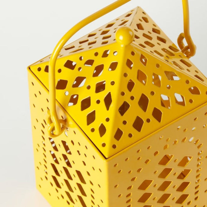 Digital Shoppy An angled image of a yellow lantern for tealight from IKEA, showcasing its stylish design and vibrant color  60523440