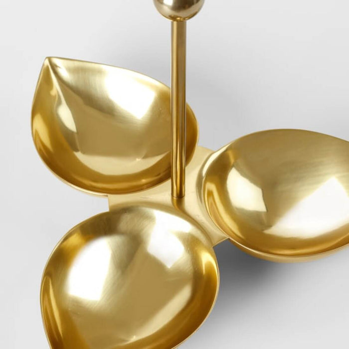 A set of three leaf-shaped serving dishes made of steel, with a gold color 80524660