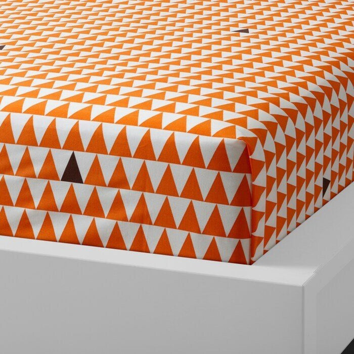 Orange cotton flat sheet and pillowcase from IKEA draped on a bed 50454786