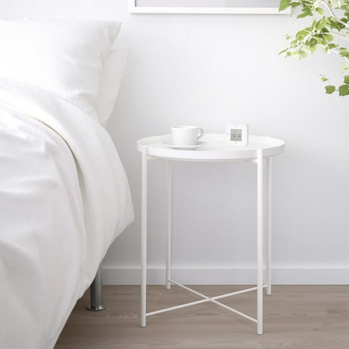 Digital Shoppy IKEA Tray table, white, 45x53 cm (17 1/2x20 5/8 ") , A view of a white tray table from above, showing its compact size and streamlined shape, with two raised edges to prevent items from sliding off 50337820