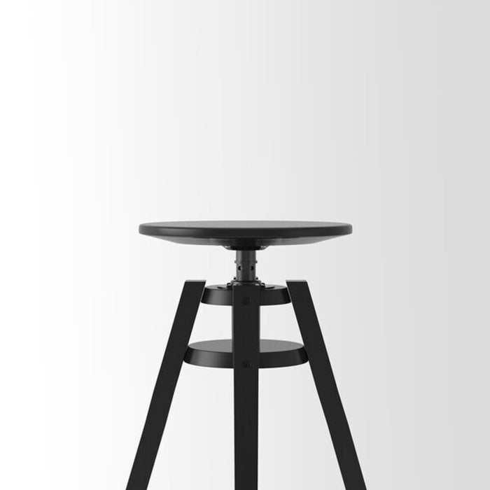 Side view of a black IKEA bar stool, featuring a footrest and adjustable height range of 63-74 cm. digital shoppy 40161595  