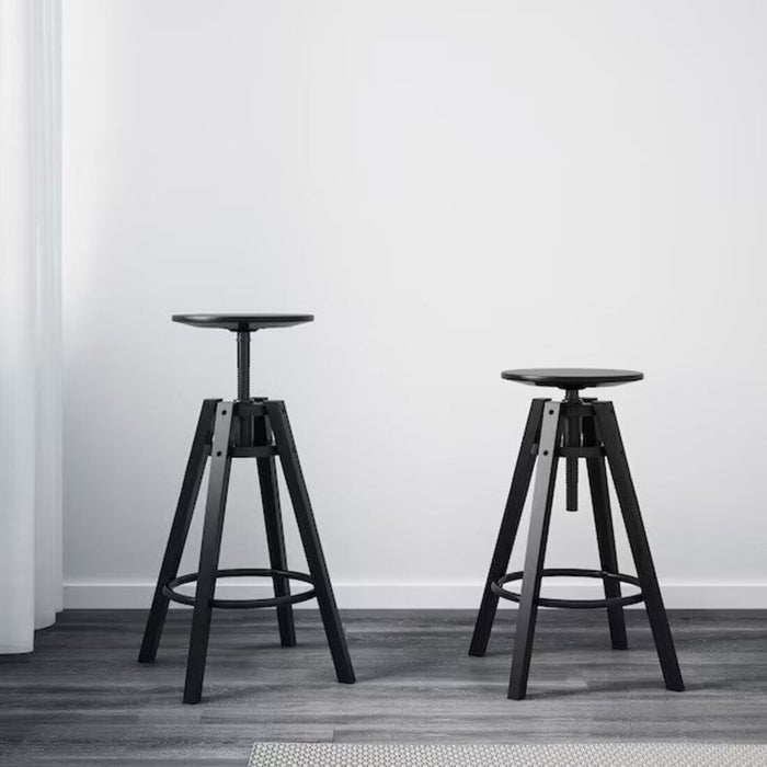 Top-down view of a black IKEA bar stool, showcasing its simple yet stylish design and adjustable height feature." digital shoppy 40161595  