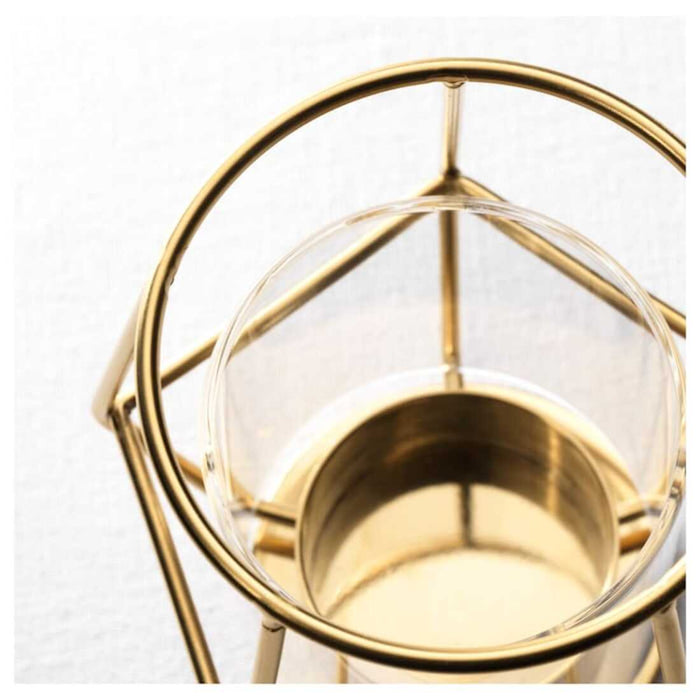 Add a touch of glamour to your home décor with this stylish tealight holder from IKEA. Its shiny metallic finish will catch the eye of any visitor 30348546