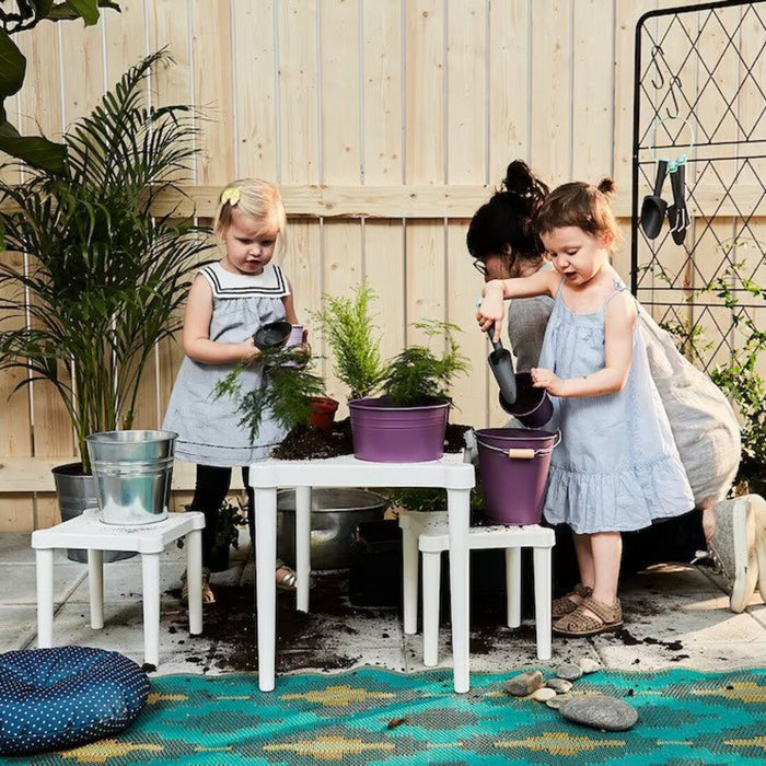 A versatile and sturdy children's table suitable for playtime and homework, designed for indoor and outdoor use by IKEA.
