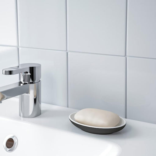 An elegant soap dish designed with a modern touch, featuring a smooth texture and a polished look 50445358