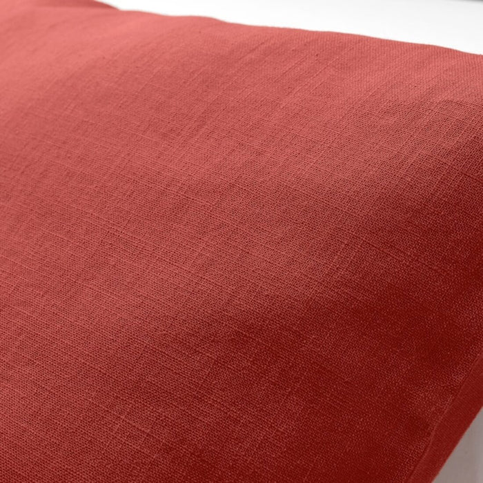 A close-up of a soft and cozy red/orange IKEA cushion cover -30326530