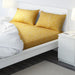 Yellow cotton flat sheet and 2 pillowcase set from IKEA on a bed  30418978