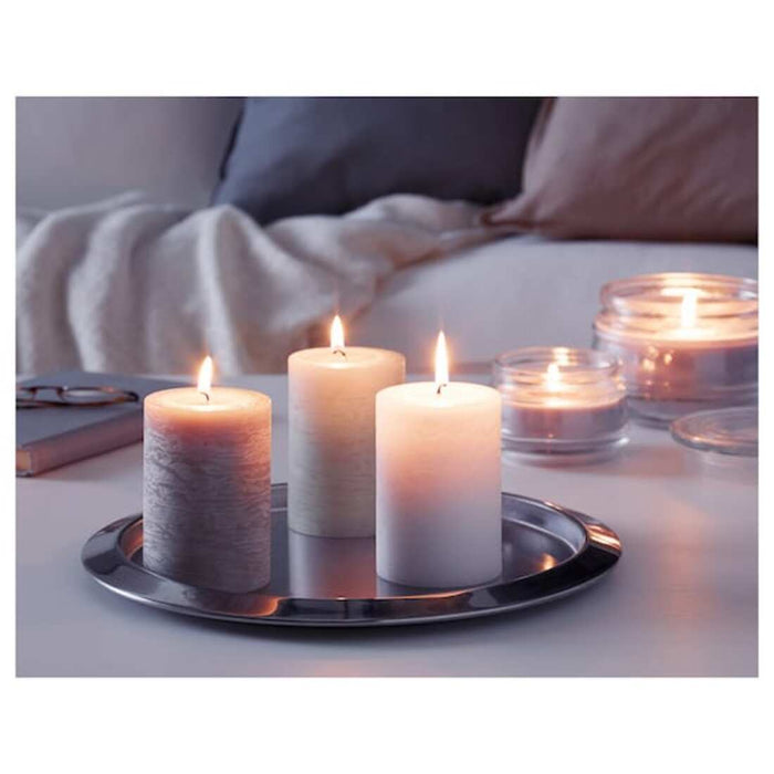 An IKEA scented block candle, creating a warm and inviting atmosphere with its pleasant aromas, perfect for special occasions or everyday use.
