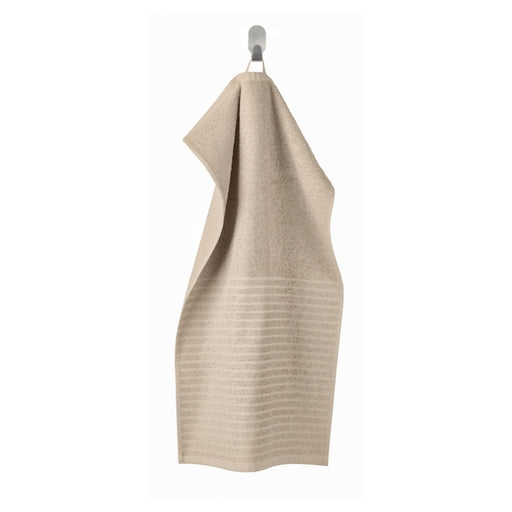 A light beige hand towel with a soft, smooth texture 40494617