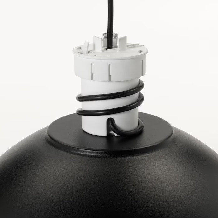 A black IKEA Pendant lamp hanging from the ceiling in a well-lit room.