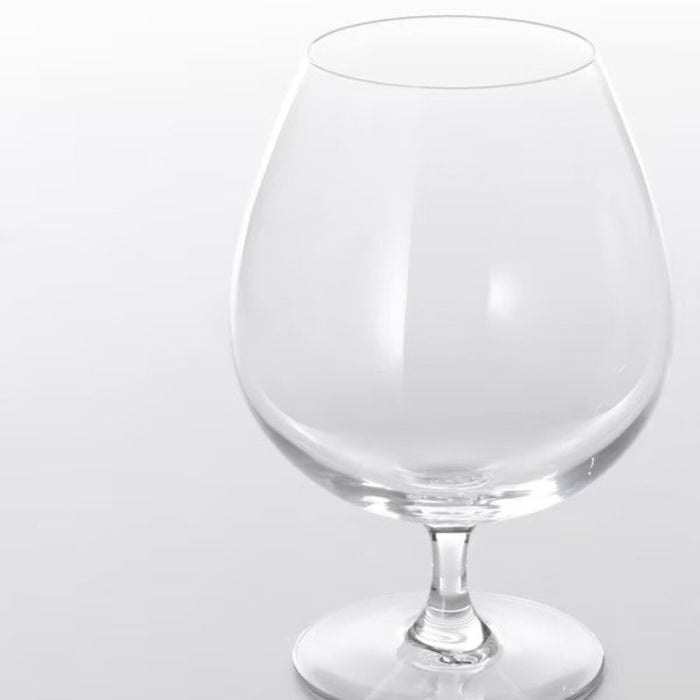 A clear glass brandy bowl with a wide base and short stem, ideal for serving and enjoying your favorite brandy.