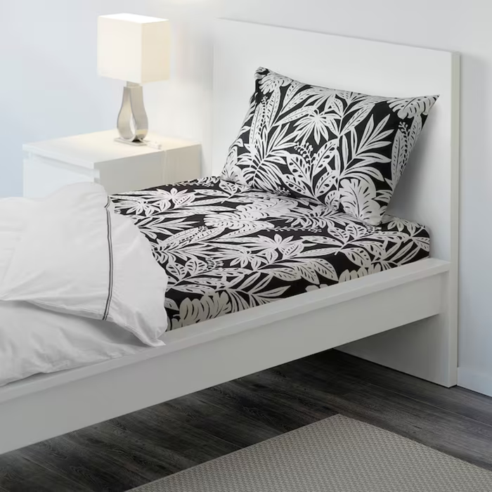 Grey-white cotton flat sheet and pillowcase from IKEA on a bed  40419005