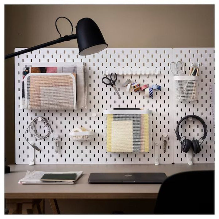 An IKEA pegboard hook rack with various hooks of different sizes and shapes, showcasing the brand's versatile and practical storage solutions. 60519886