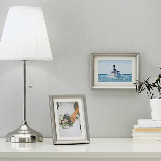 Add a touch of elegance to your home decor with the silver-colored IKEA Frame 70297432